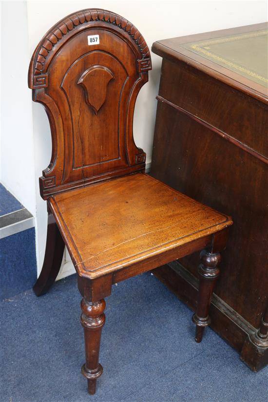 A pair of Victorian mahogany hall chairs